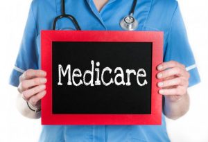 nurse-holding-medicare-sign